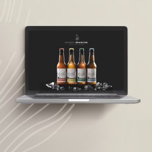 Mockup du site Maison Branche affichant la gamme de bières artisanales, illustrant un univers haut de gamme ancré dans le terroir