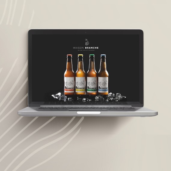 Mockup du site Maison Branche affichant la gamme de bières artisanales, illustrant un univers haut de gamme ancré dans le terroir